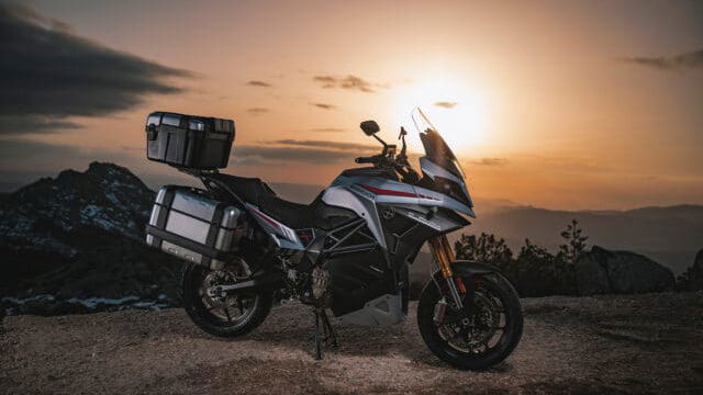 Energica Experia parked in front of a sunset