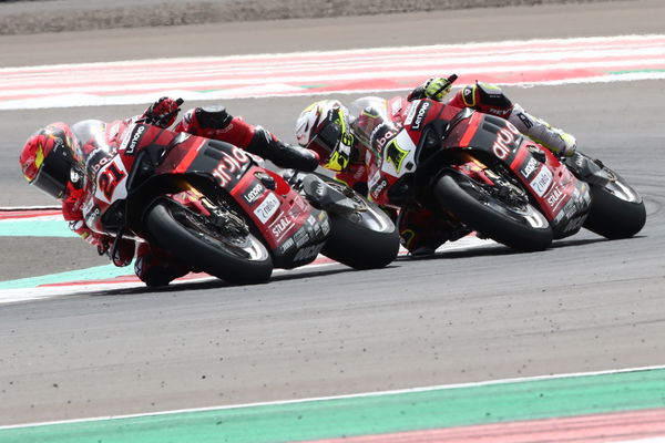 Michael Ruben Rinaldi leads Alvaro Bautista, 2023 Indonesian WorldSBK. - Gold and Goose