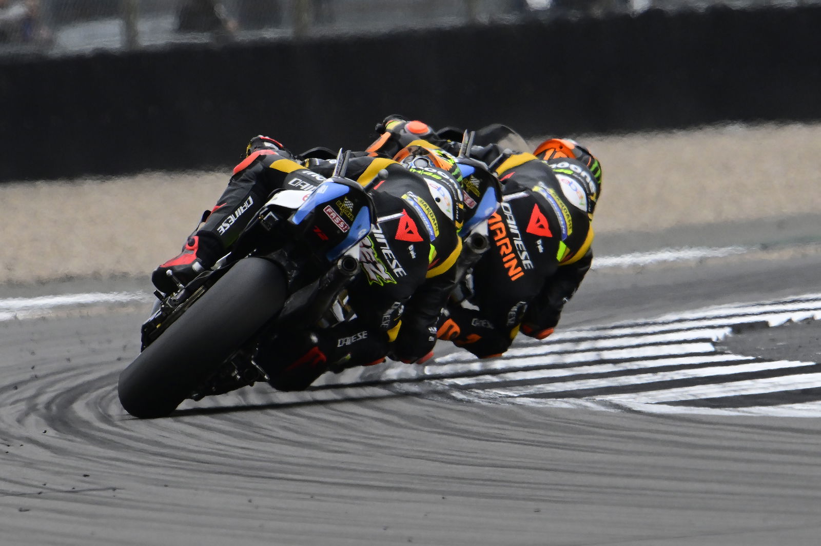 Luca Marini leads Marco Bezzecchi, 2023 MotoGP British Grand Prix. - Gold and Goose