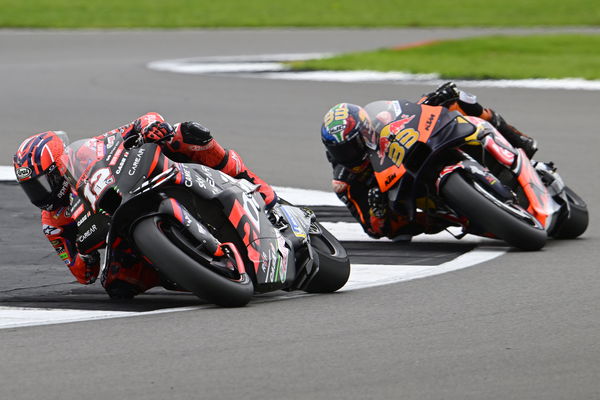 Maverick Vinales leads Brad Binder, 2023 MotoGP British Grand Prix. - Gold and Goose