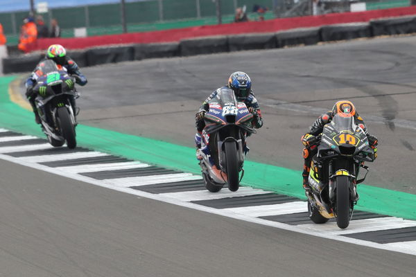 Luca Marini leads Miguel Oliveira, Franco Morbidelli, 2023 MotoGP British Grand Prix. - Gold and Goose