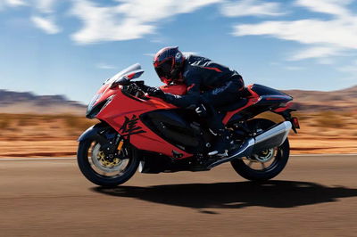 A motorcycle riding along a desert road