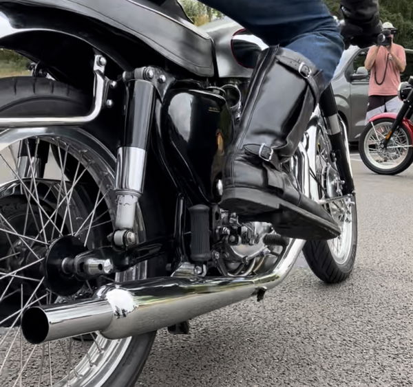 a BSA Gold Star being kicked over to start the engine