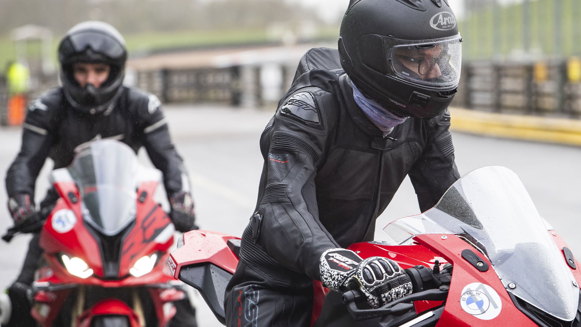 Two riders in the pit lane at Mallory Park