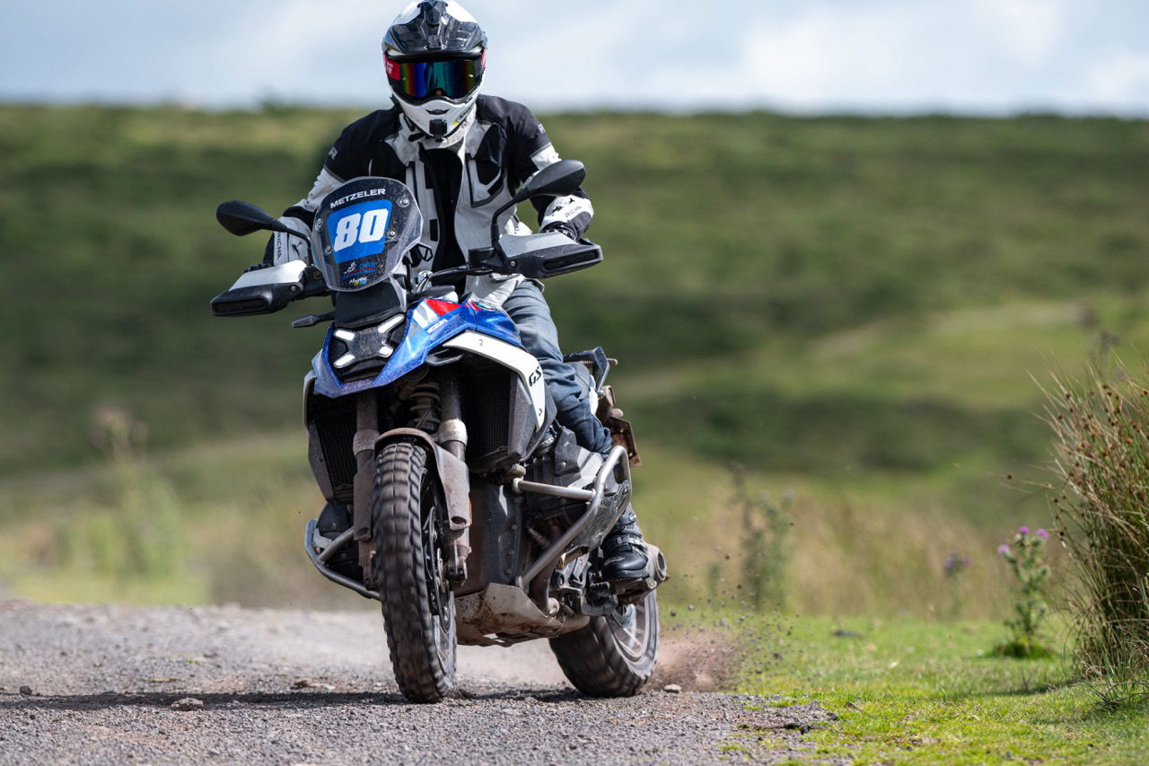 A BMW R1300 GS sliding on gravel