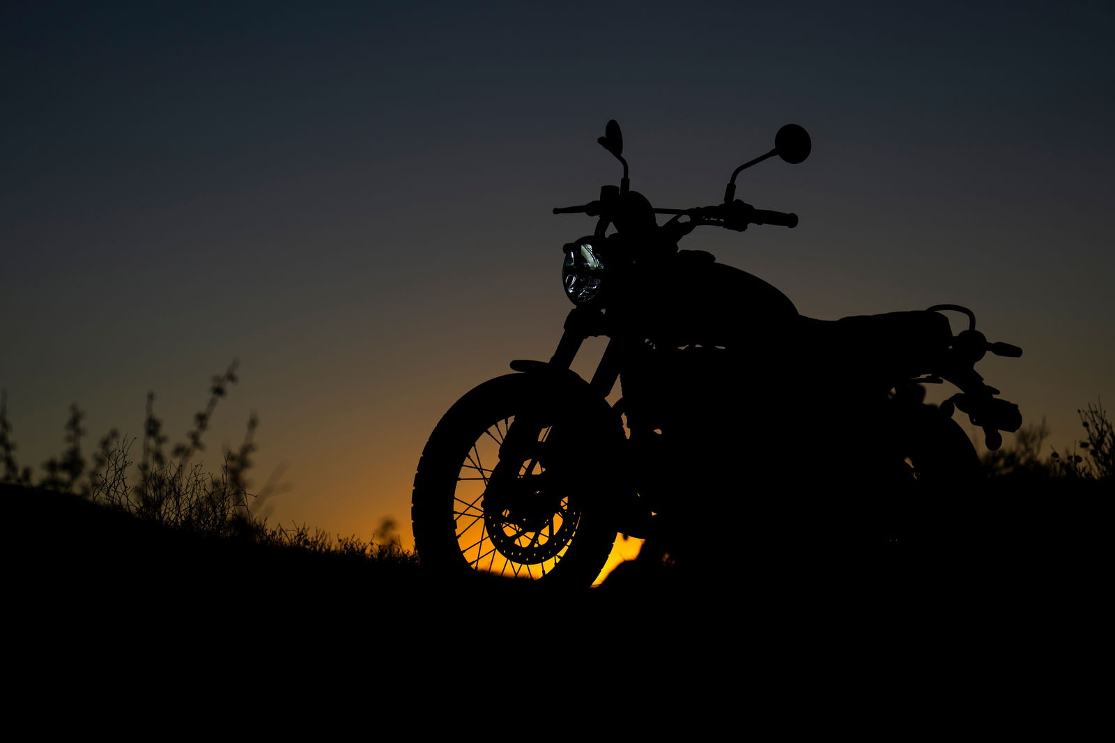The sun setting behind the bike