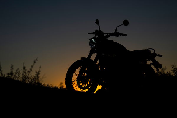 The sun setting behind the bike