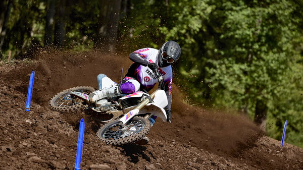 a motocross bike jumps in the air