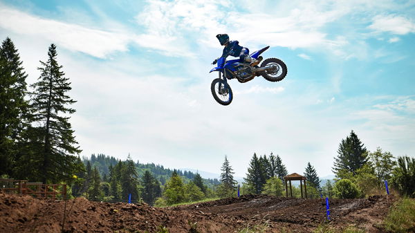 a motocross bike jumps in the air