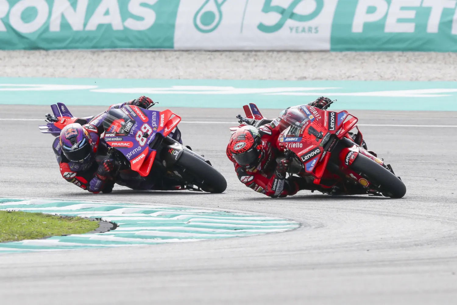 Bagnaia being chased by Martin in the 2024 Malaysian MotoGP round