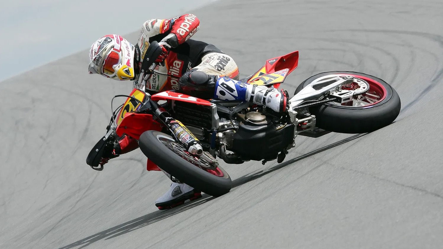 Christian Iddon riding a race-prepped supermoto at Donington Park