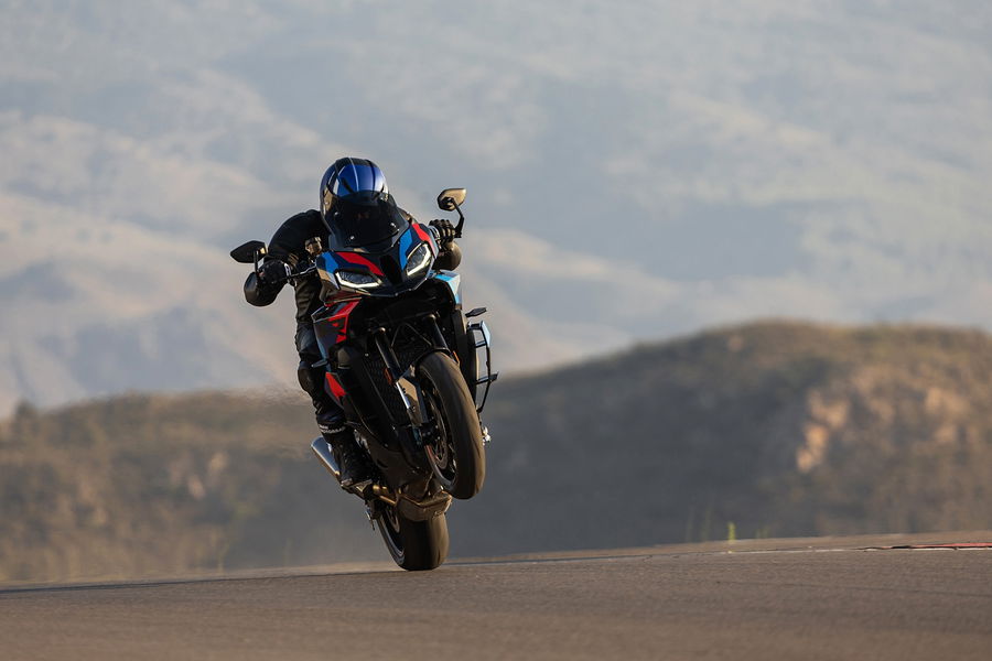 A BMW M1000 XR being ridden on track