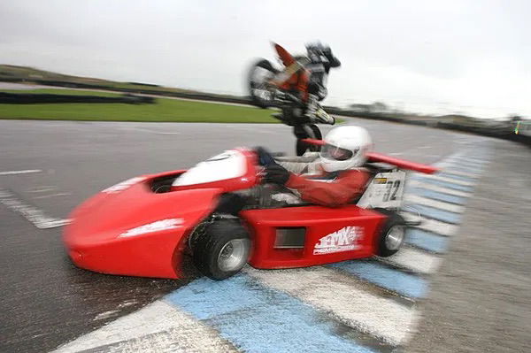 A KTM 450 races a 250cc Superkart