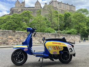 Lambretta scooter in front of castle