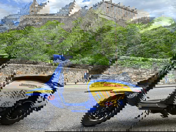 Lambretta scooter in front of castle
