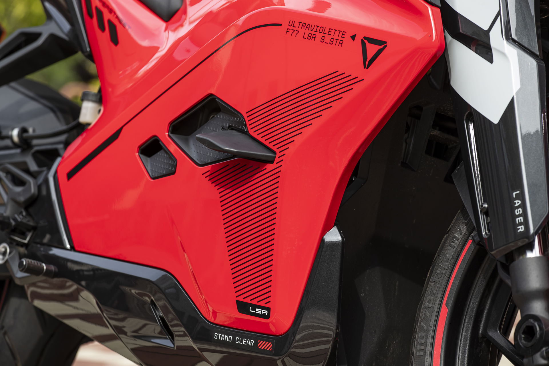 The wings on the side are not just there for show, but also protect the bike in a fall as demonstrated by one rider