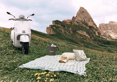 Vespa GTS SuperTech 310 set up next to a picnic. Credit - Andy Massaccesi