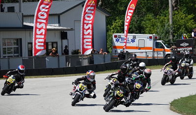 A MiniGP grid heading into a turn. Photo Credit - Larry Lawrence