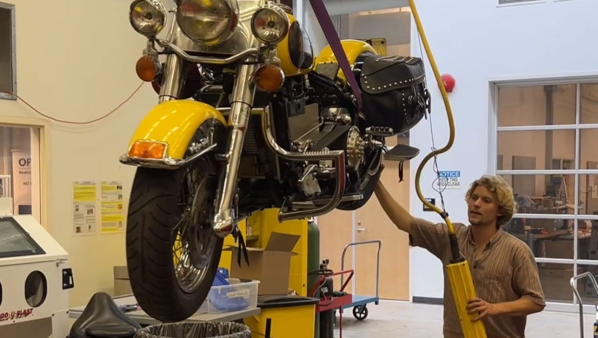 Alex Jennison works on his biodiesel-powered Harley