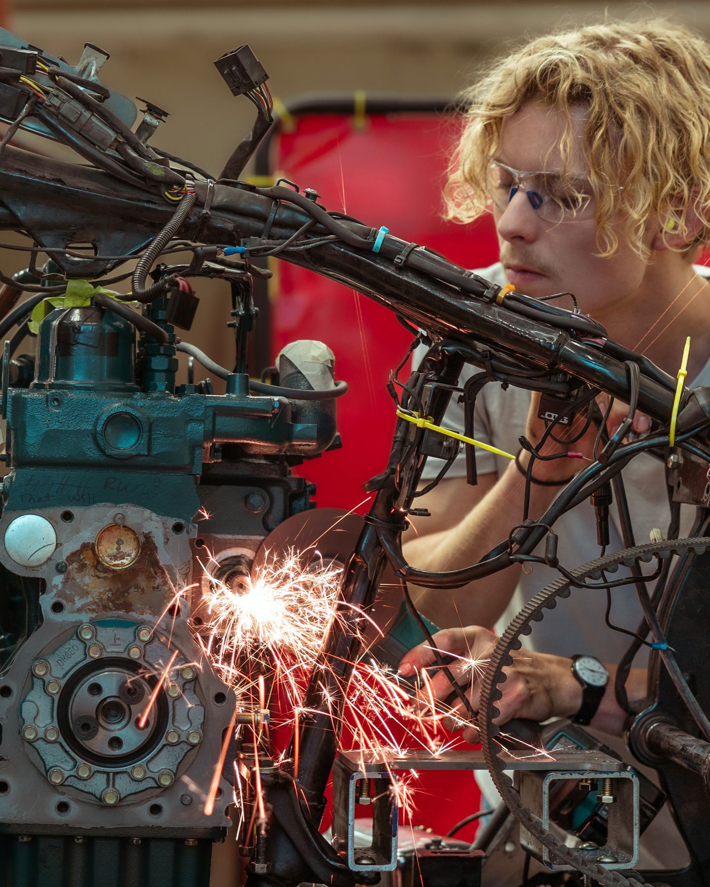 Alex Jennison works on his biodiesel-powered Harley