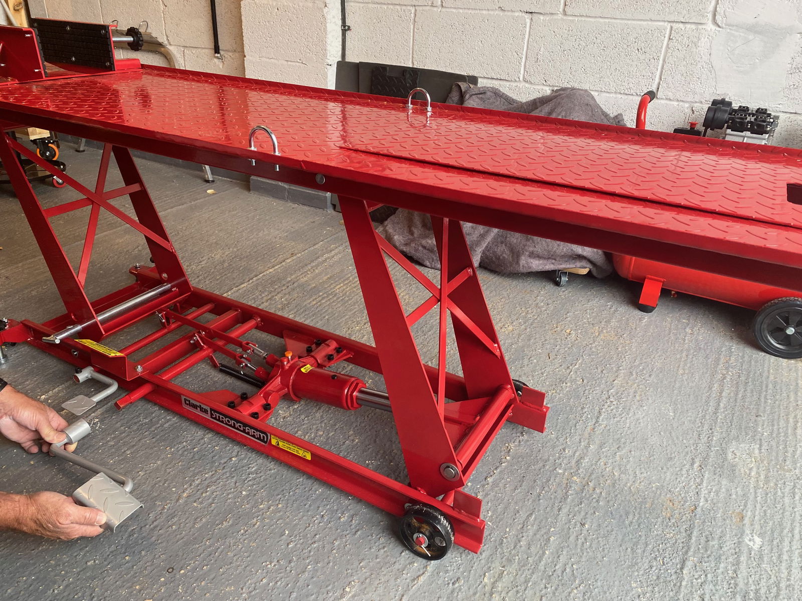 The top deck is chequered steel to aid grip when placing the bike