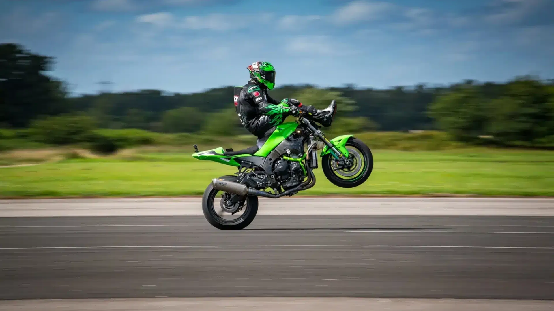 JD Stunts pulling a wheelie while seated on the handlebars