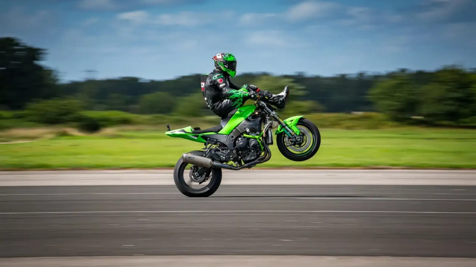 JD Stunts pulling a wheelie while seated on the handlebars