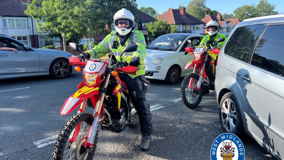 West Midlands Police officers on off-road motorcycles