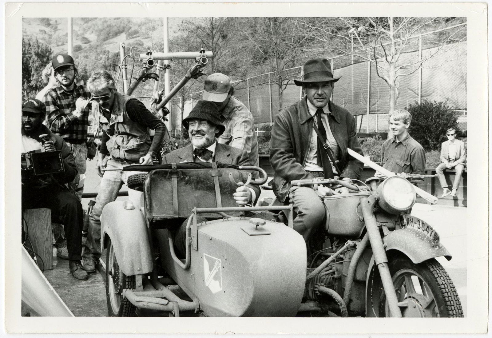 Harrison Ford and Sean Connery riding in the sidecar