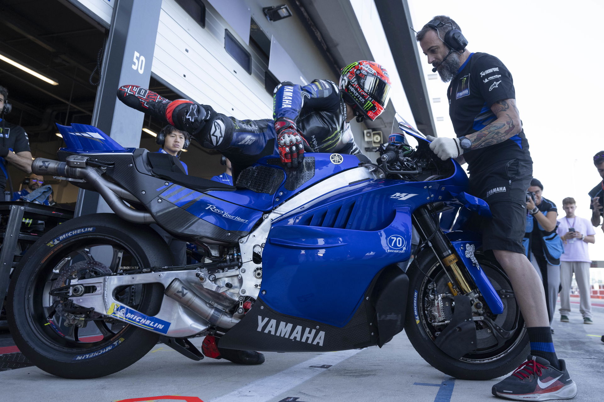 Fabio Quartararo getting on his Yamaha V4 bike