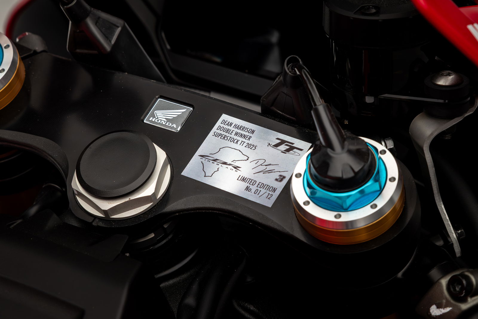 The top-clamp includes a special numbered plaque