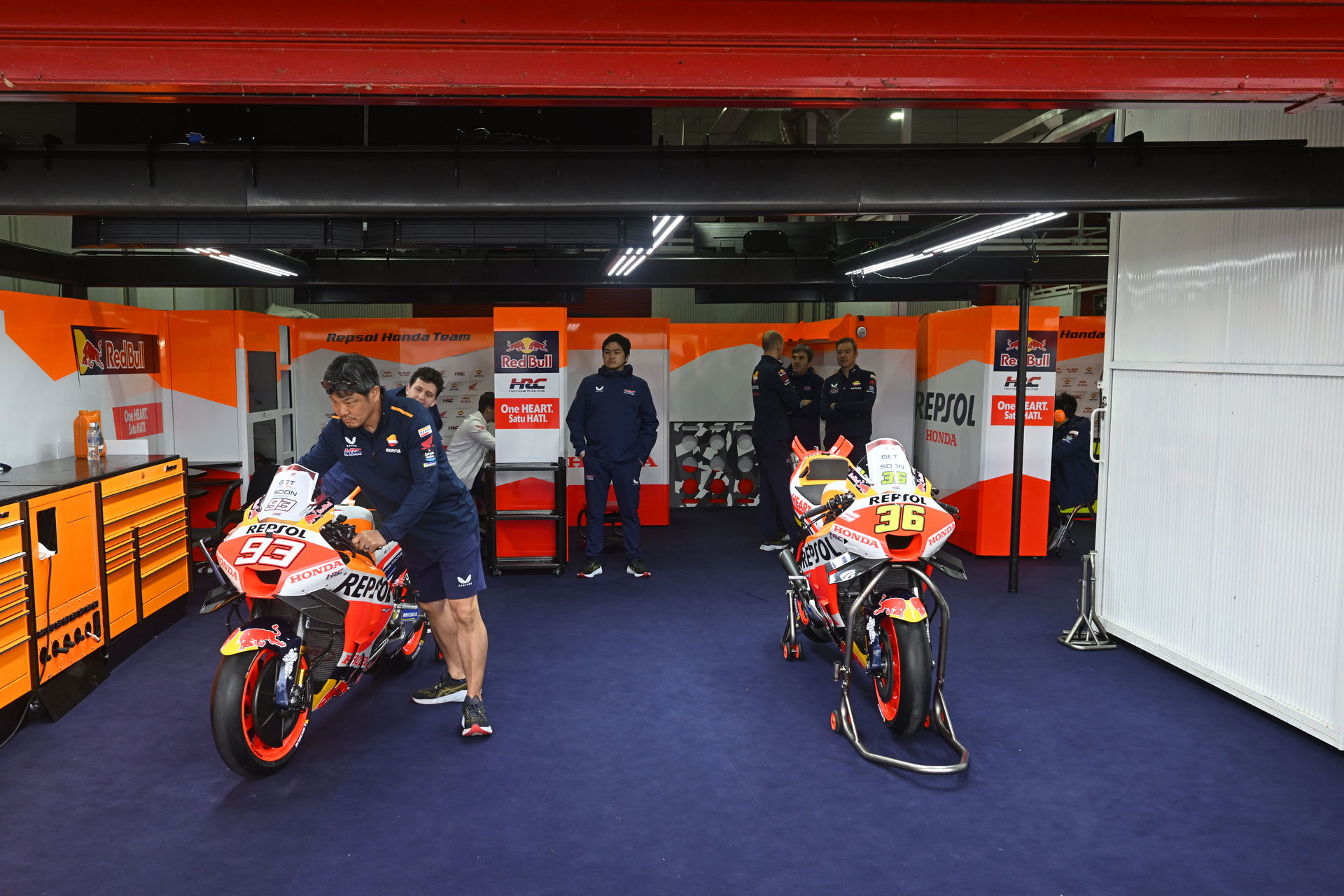 Two Honda MotoGP bikes in their garage