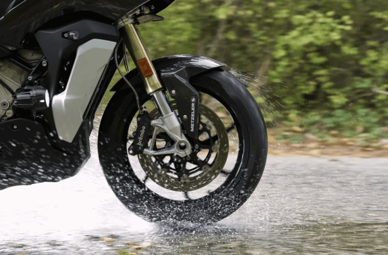 Metzeler tyre riding on a wet road