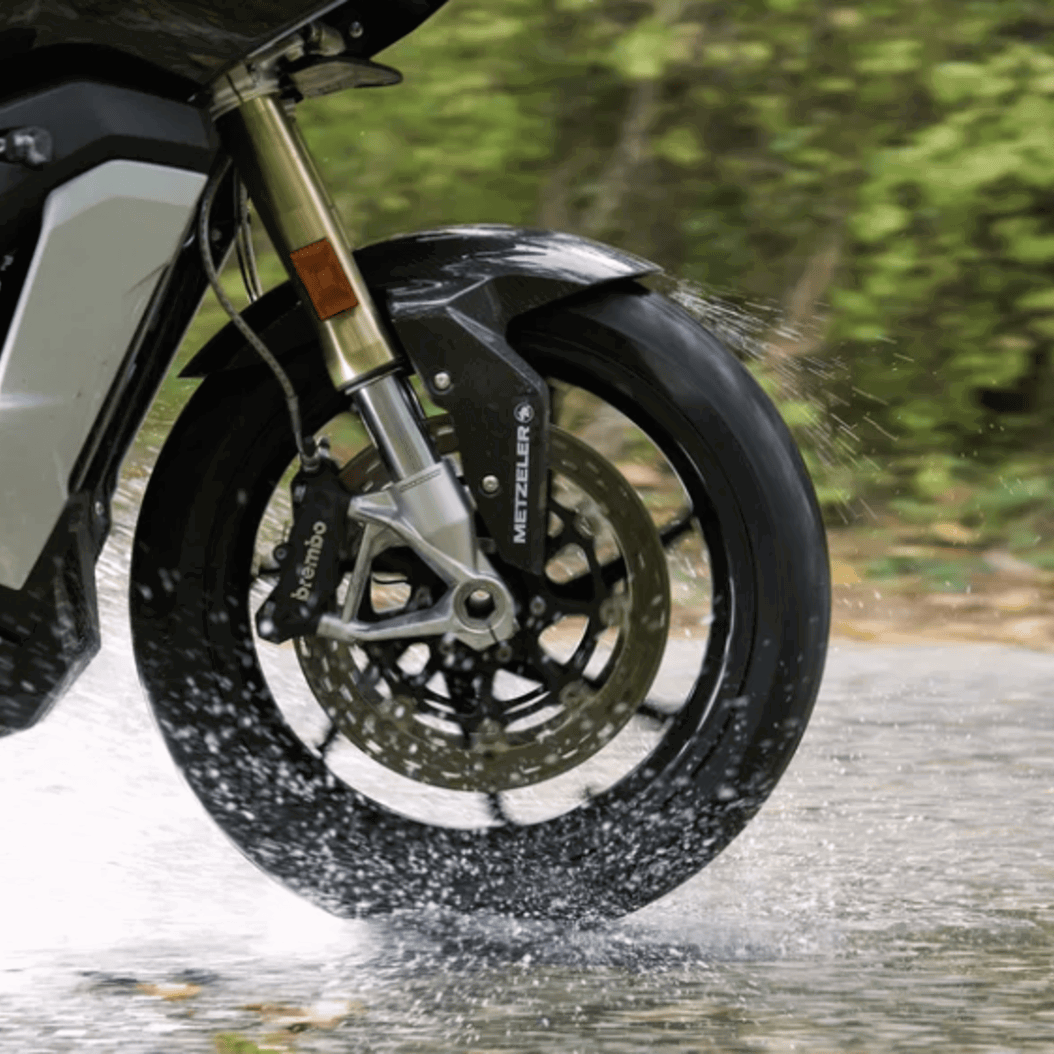 Metzeler tyre riding on a wet road