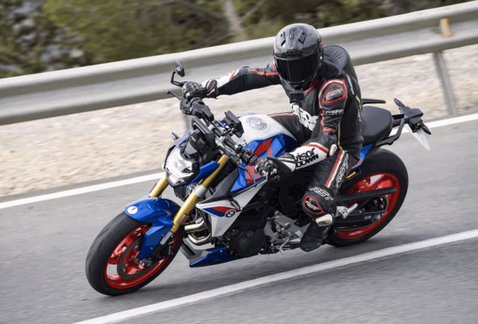 BMW F900 R being ridden on the road