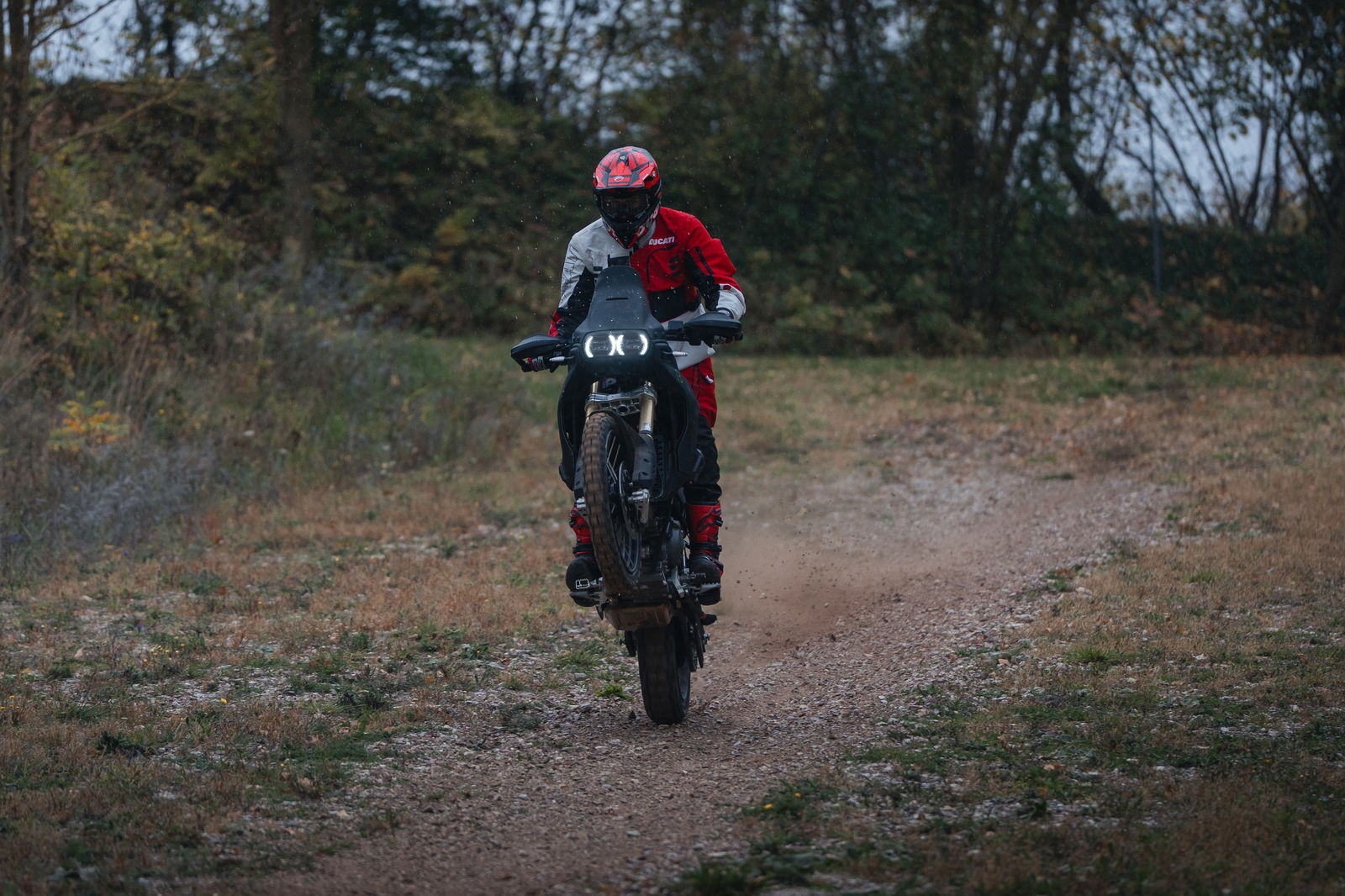 Ducati DesertX pulling a wheelie off-road
