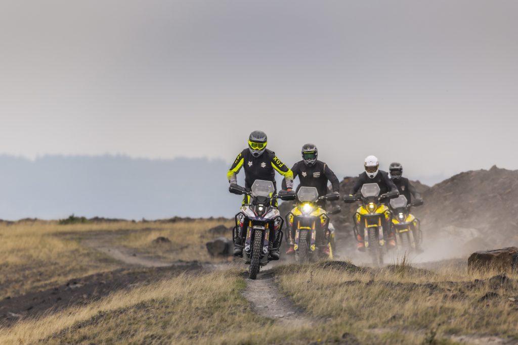 Suzuki motorcycle riding through trails