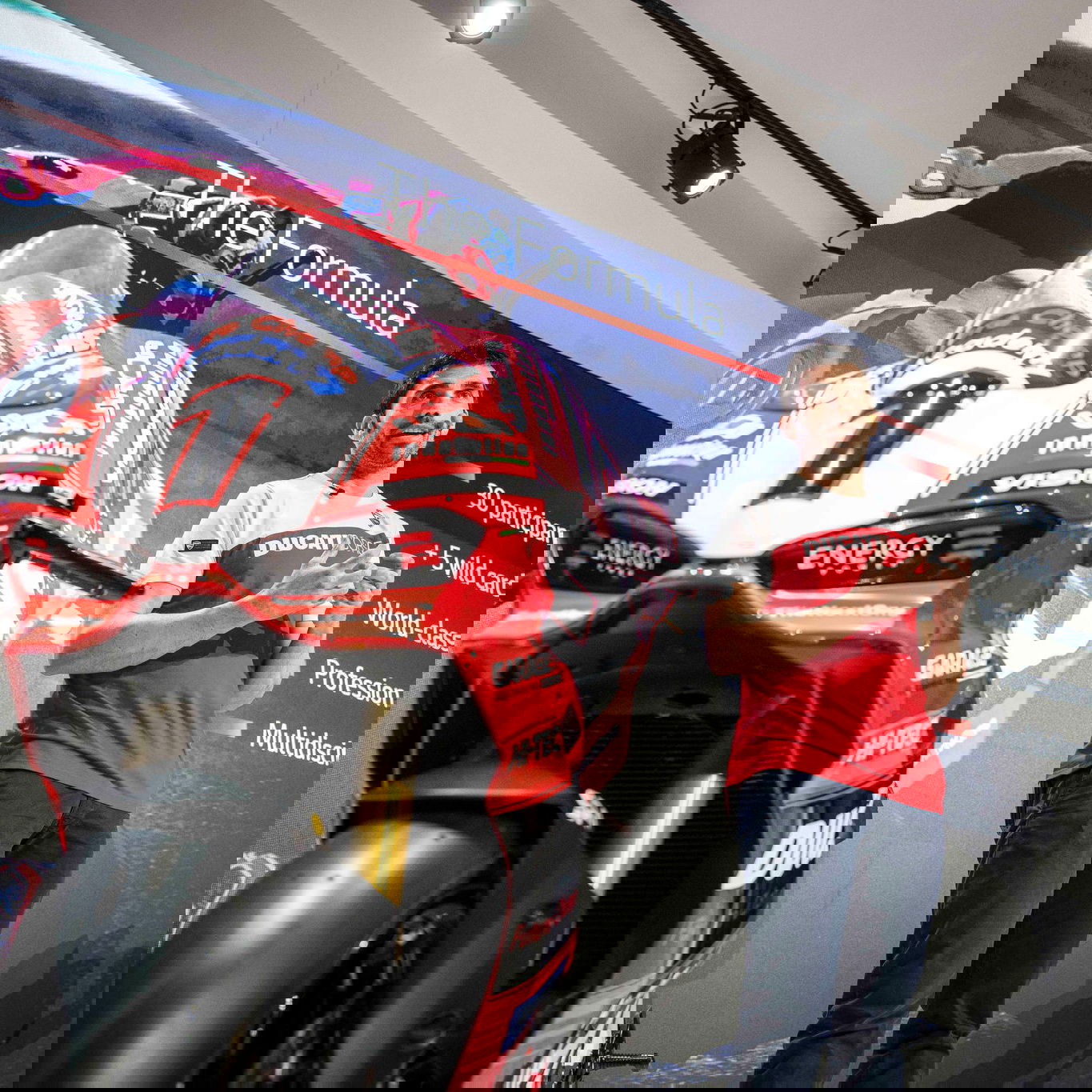 Ducati Panigale V2 S and Michele Pirro on stage