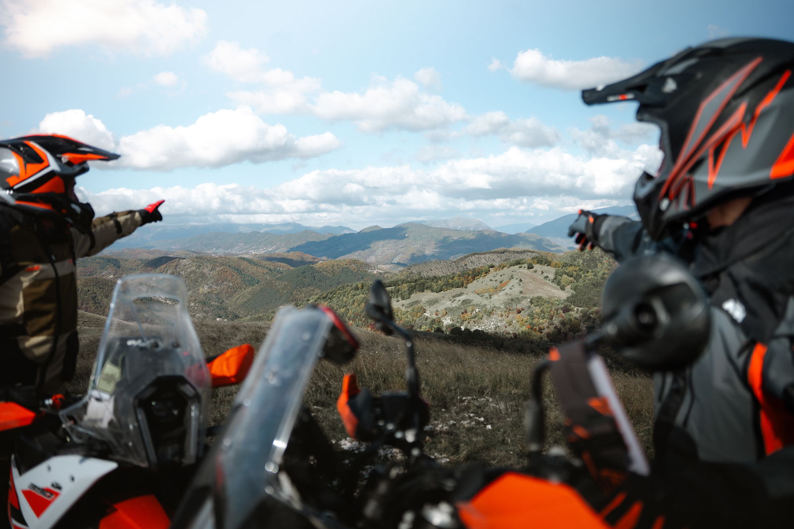 KTM riders pointing at the scenic views