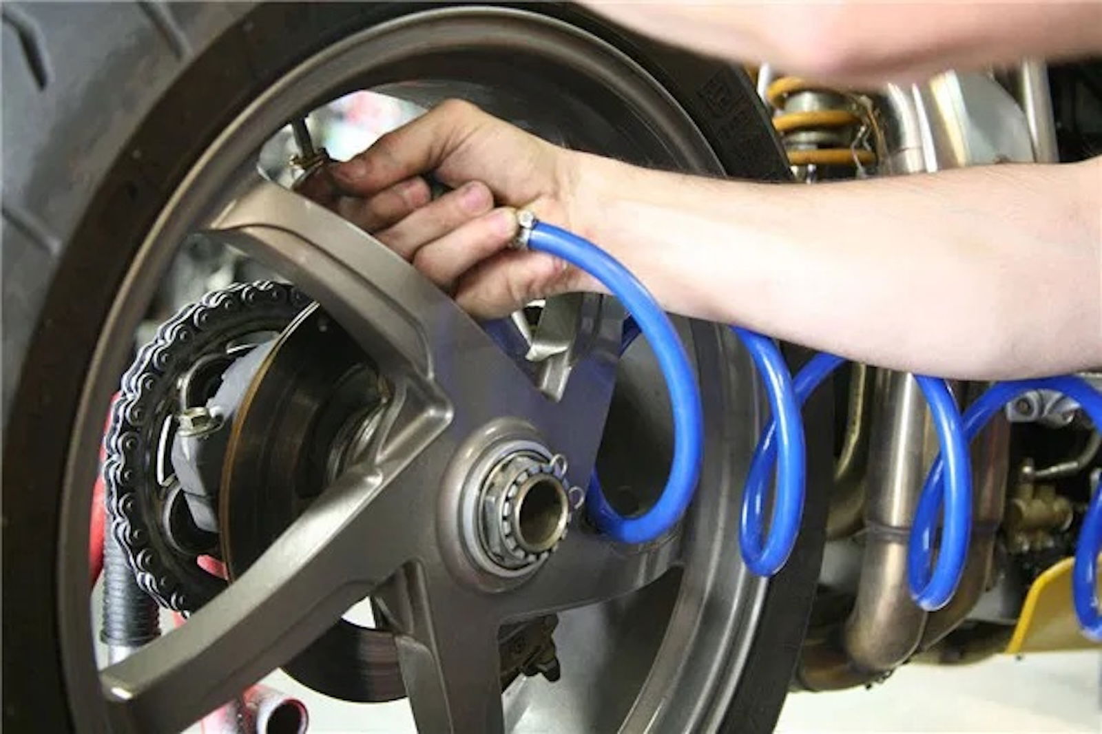 Pumping up the tyre of a Ducati 916