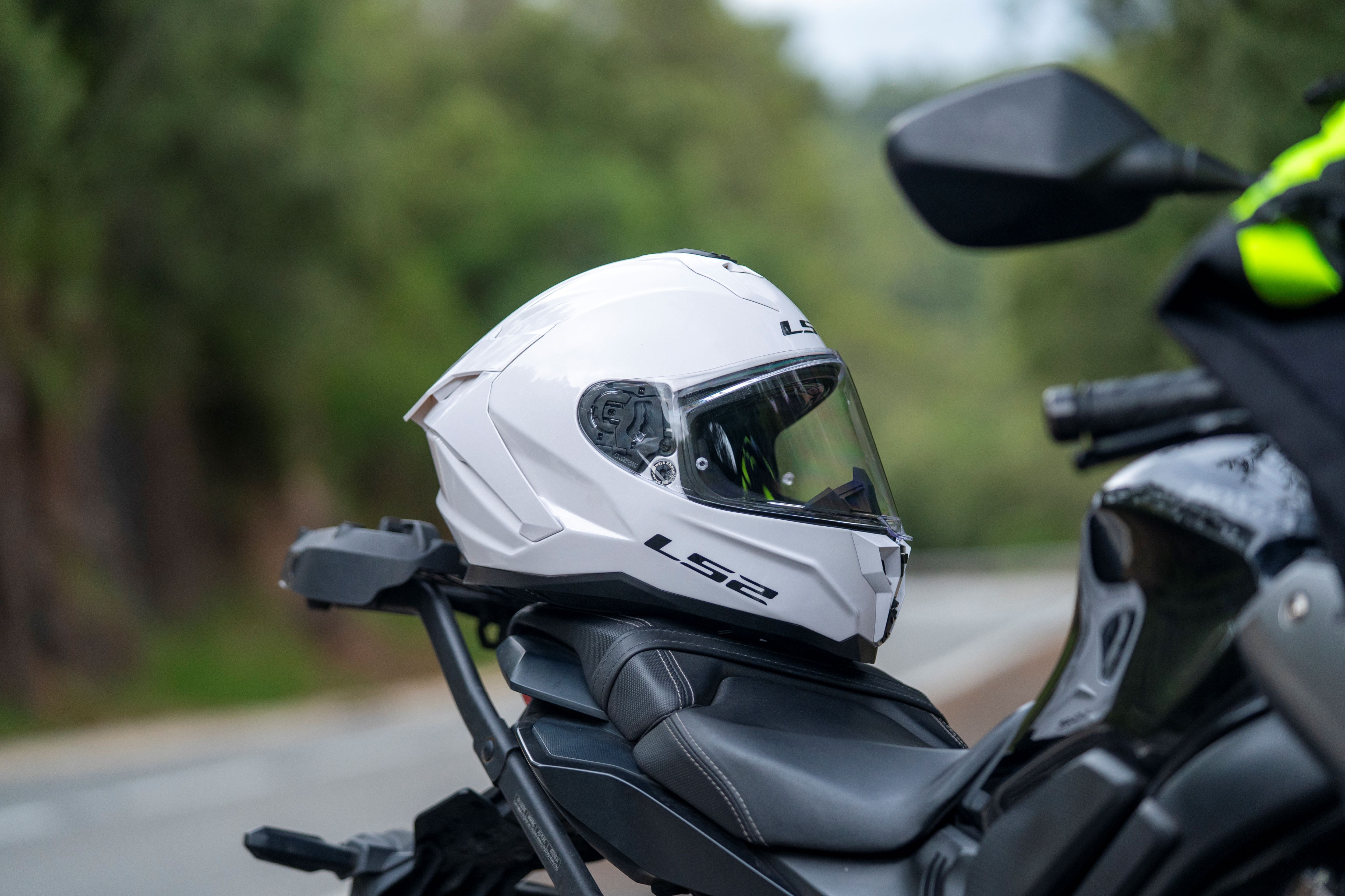 LS2 Challenger II helmet resting on a motorcycle