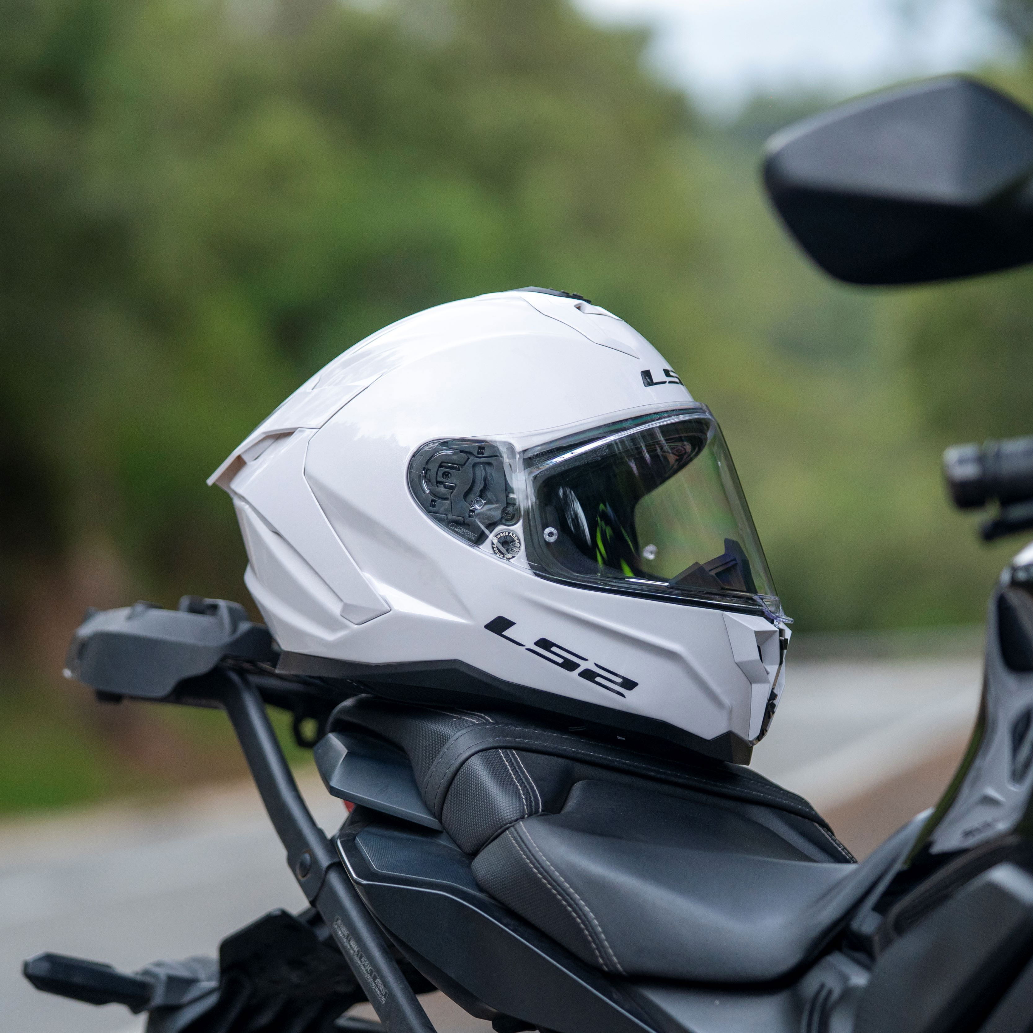 LS2 Challenger II helmet resting on a motorcycle
