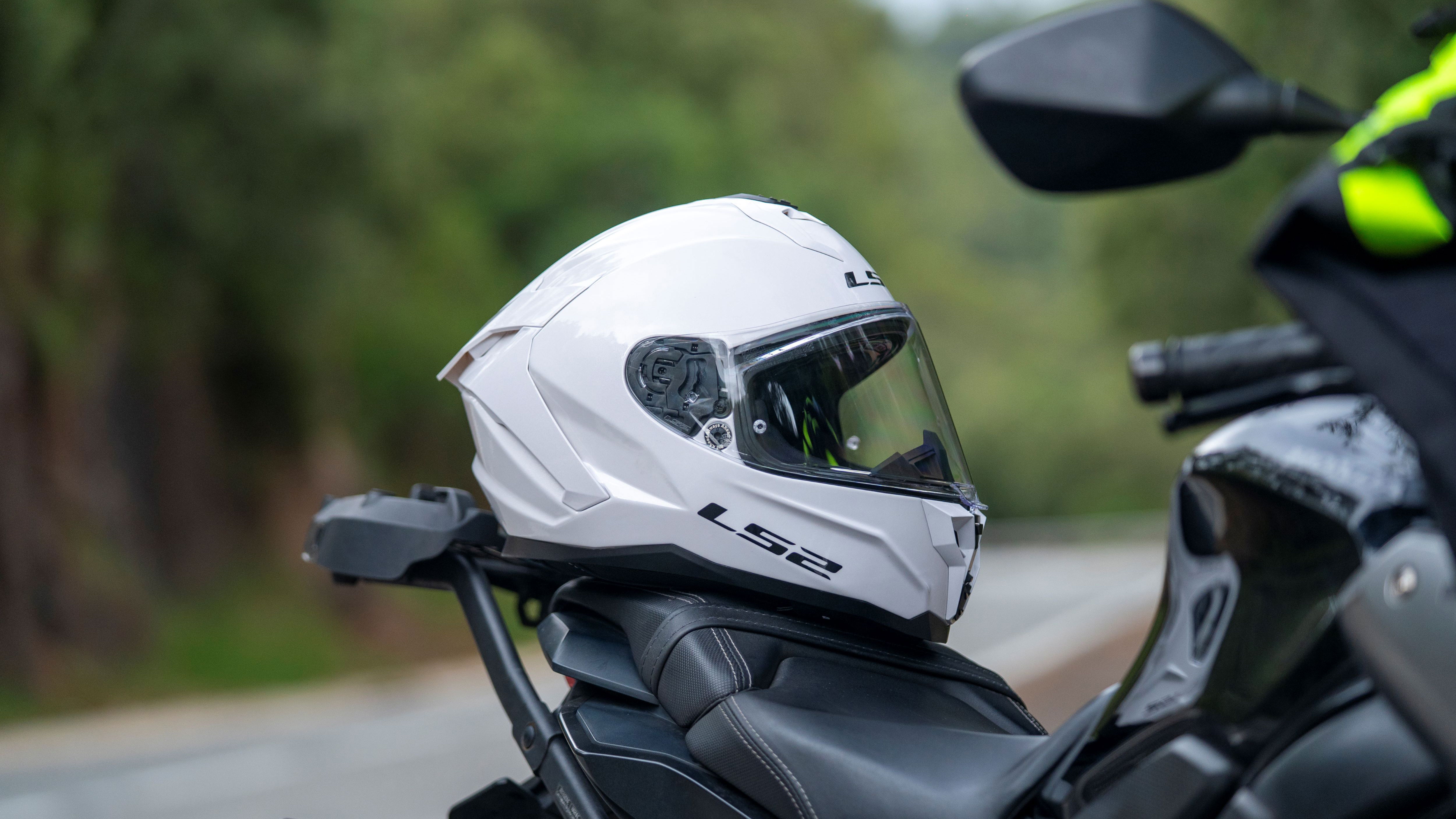 LS2 Challenger II helmet resting on a motorcycle