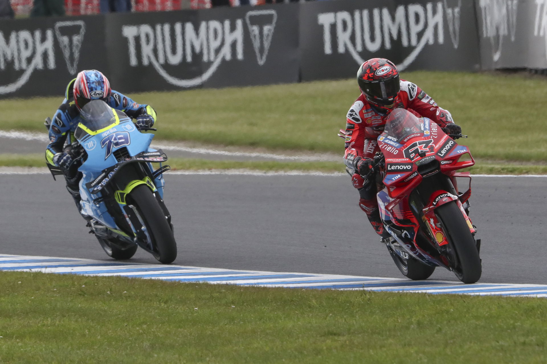 Francesco Bagnaia, Ai Ogura, 2025 MotoGP Australian Grand Prix. Credit: Gold and Goose.