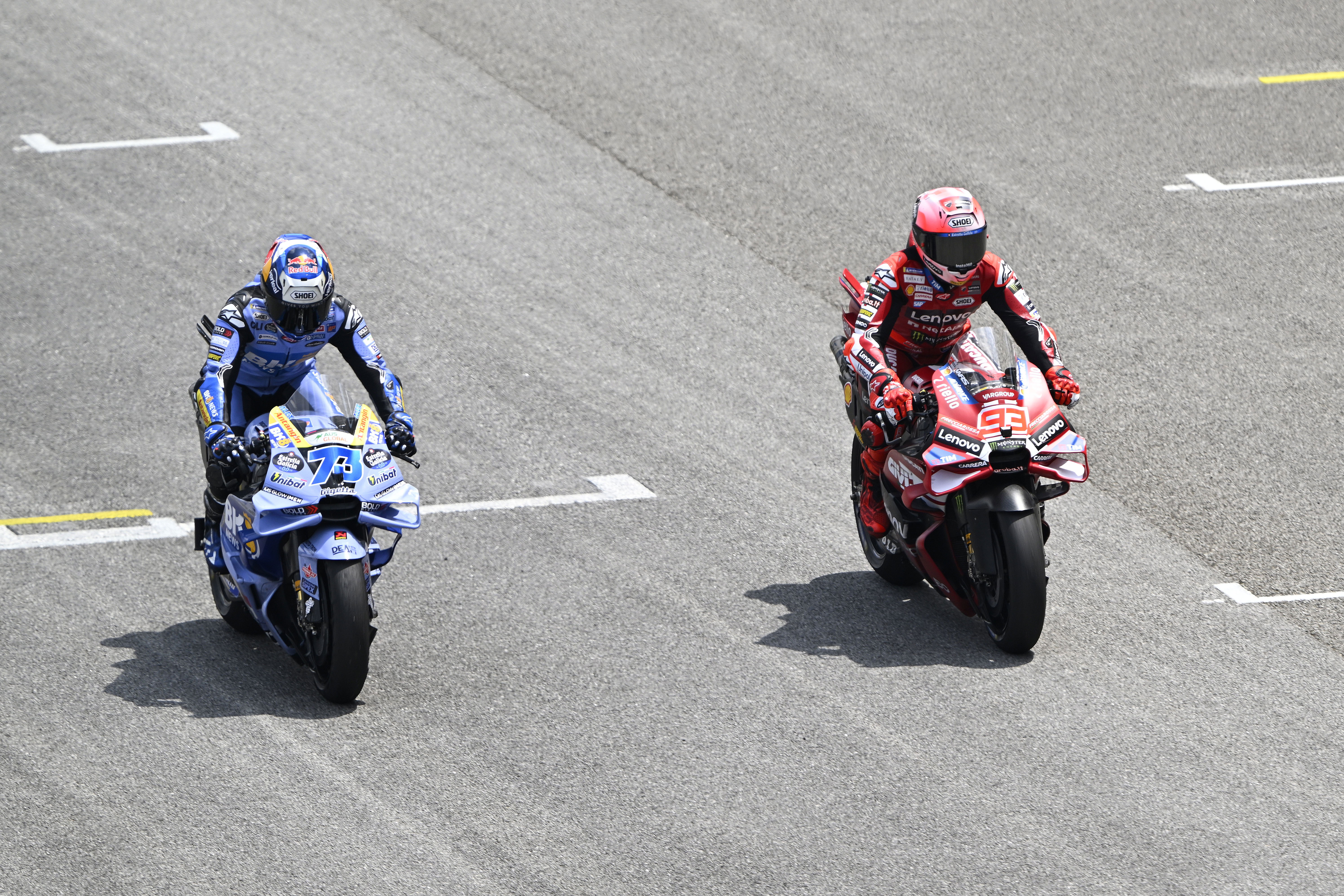 Alex Marquez and Marc Marquez rolling up to practice starts, 2026 MotoGP Sepang Test. Credit: Gold and Goose.