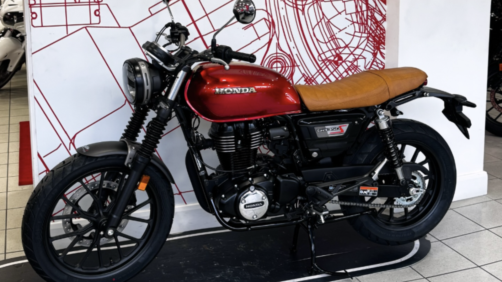 Honda GB350S in red with a toffee seat. Photo credit - Doble Motorcycles