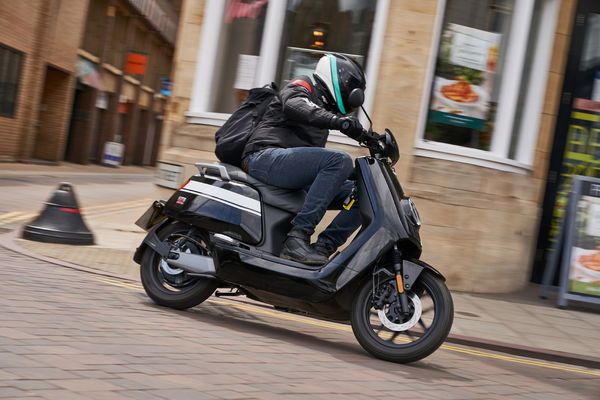 electric city commuter scooter riding