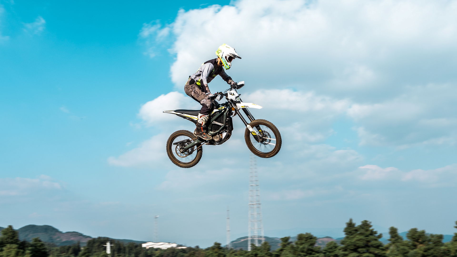 A Sur-Ron Ultra Bee flying through the air