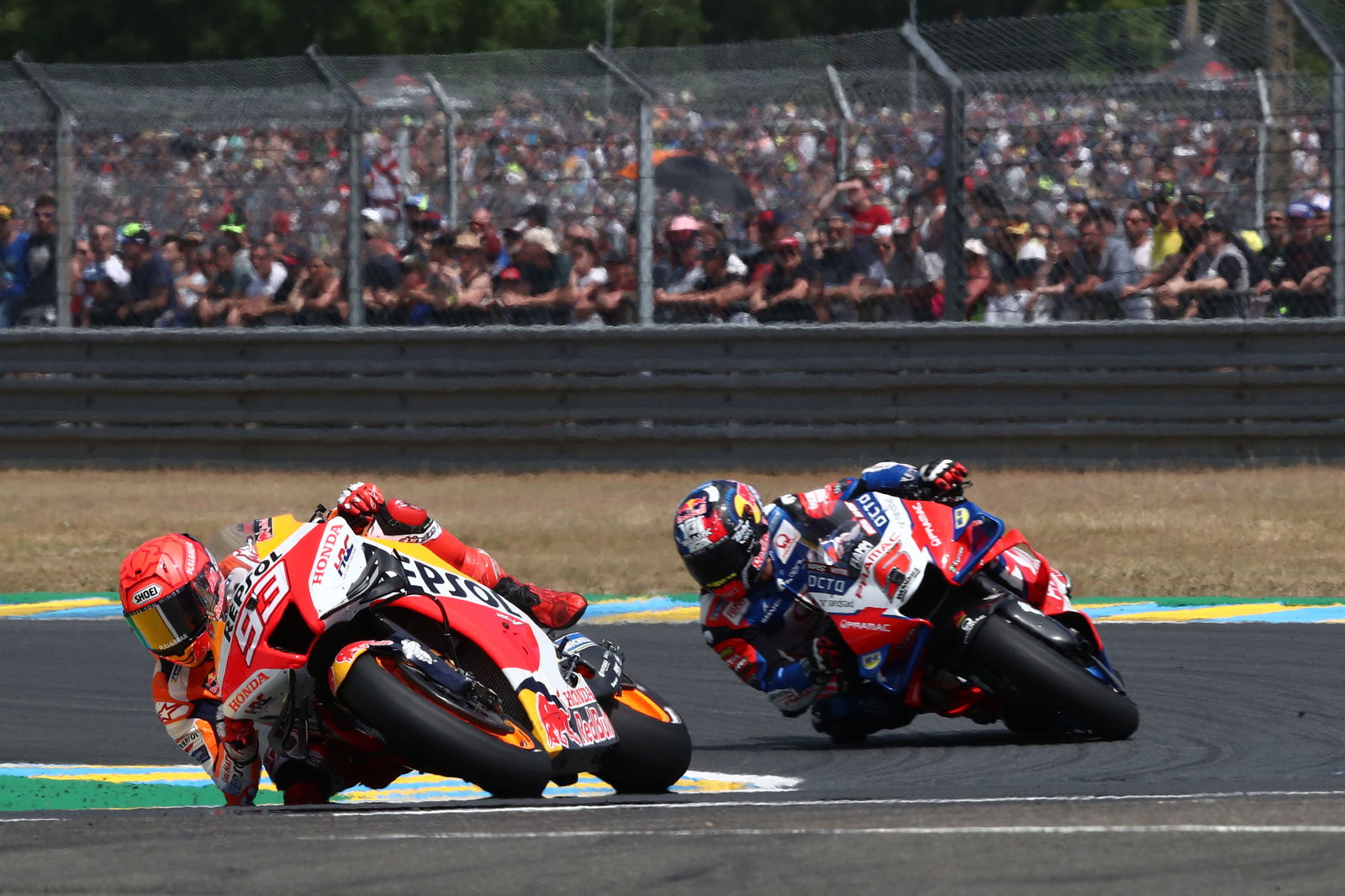 Marc Marquez leads Johann Zarco, 2022 French Grand Prix. - Gold and Goose