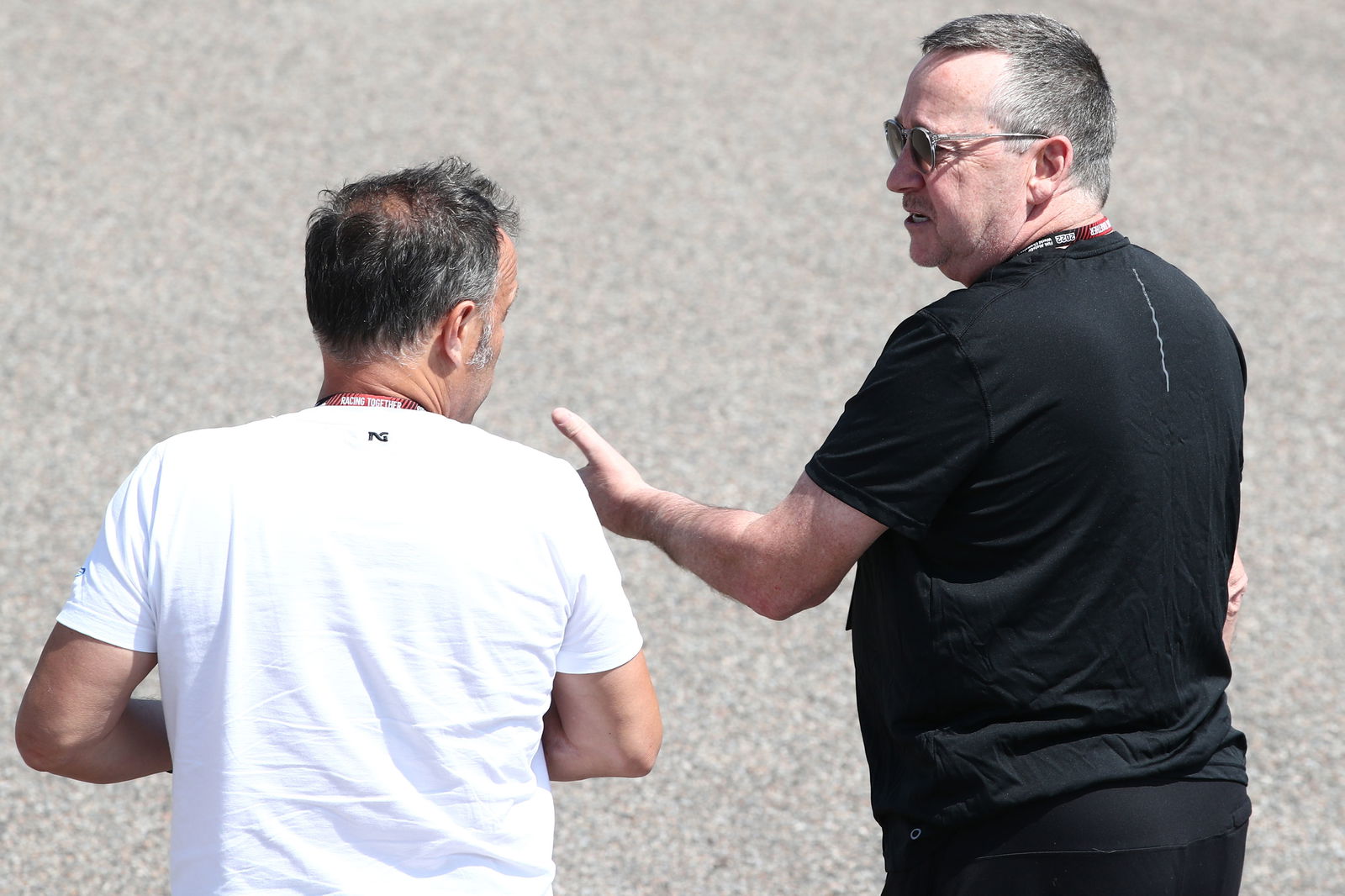 Freddie Spencer speaks with Loris Capirossi, 2023 German Grand Prix. - Gold and Goose